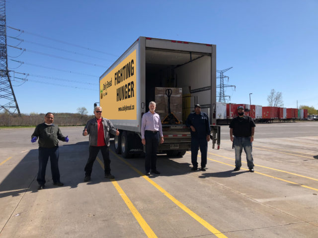 Recochem employees load up a shipment of hand sanitizer for distribu